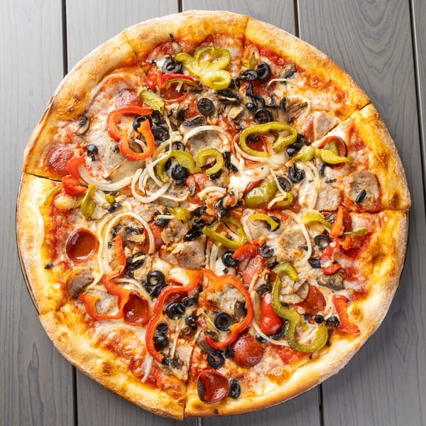 A whole pizza with pepperoni, sausage, mushrooms, onions, olives, and bell peppers.