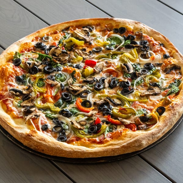 Annie's Pizza Subs & Wings' vegetarian pizza, topped with olives, mushrooms, peppers, and onions.