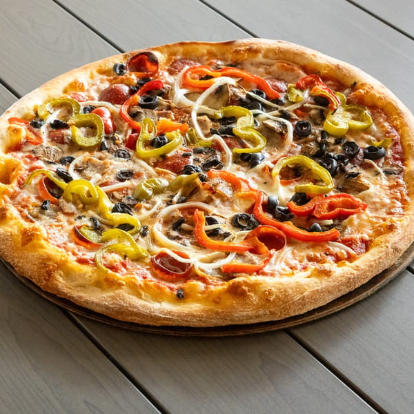 A whole Annie's Pizza with pepperoni, olives, onions, mushrooms, and colorful bell peppers.